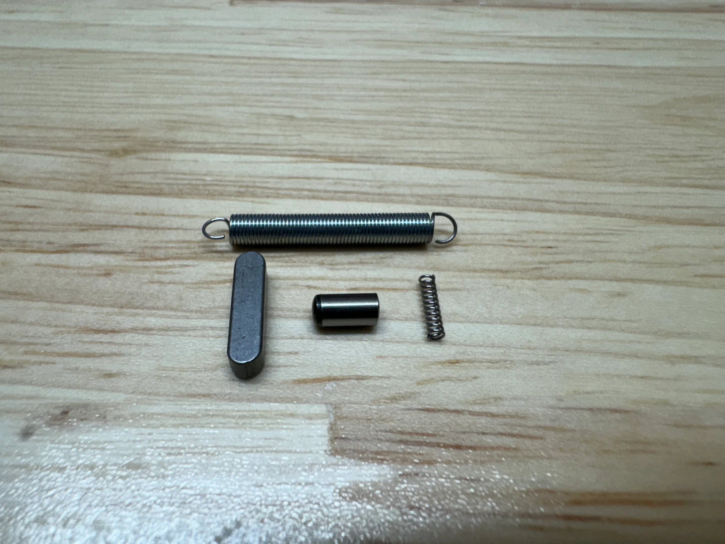 Mechanical components on a wooden surface