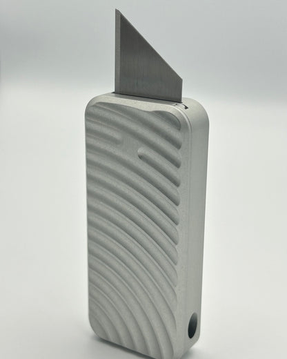 Original Zero knife standing vertically with blade exposed
