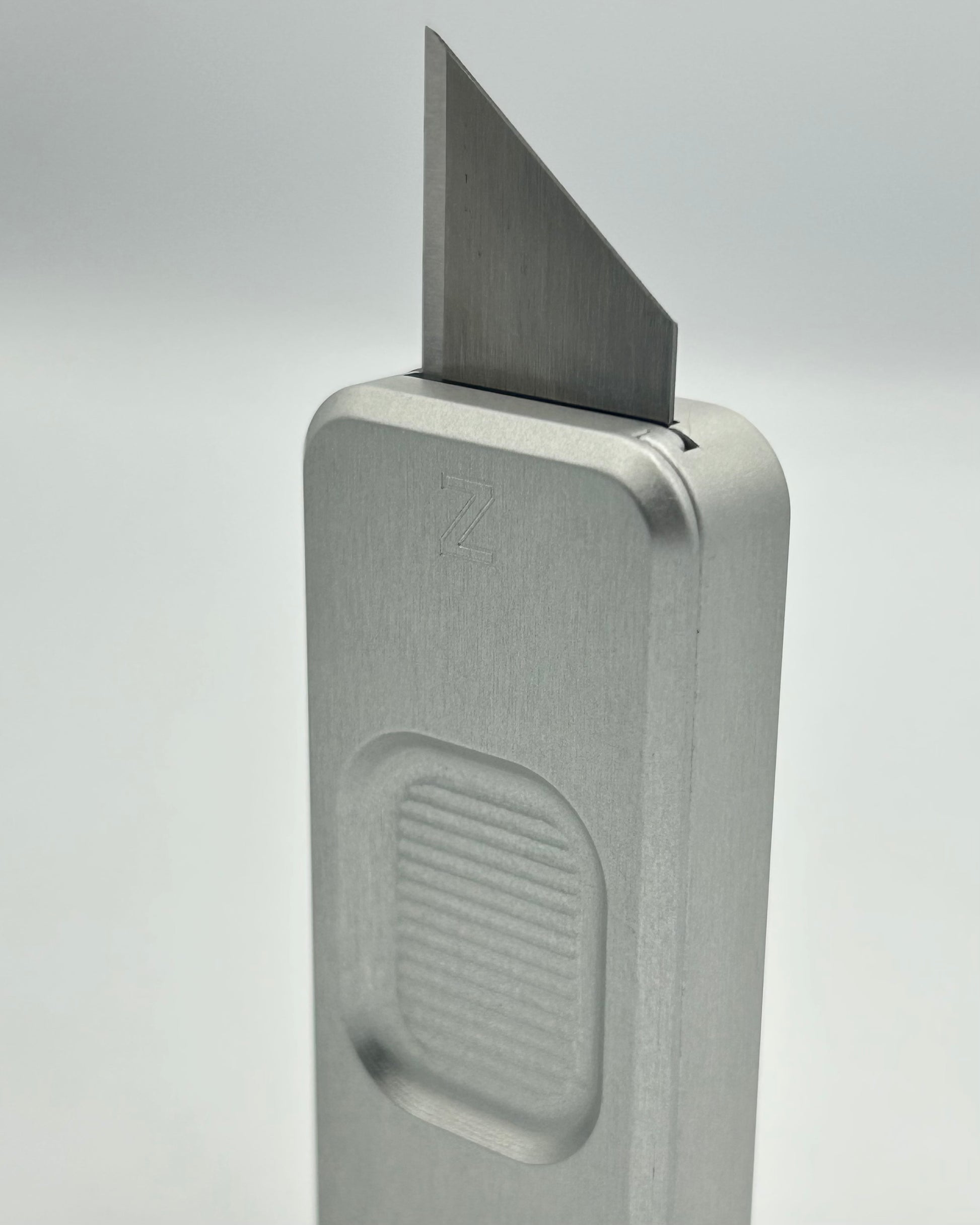 Smooth Operator Zero knife standing vertically with blade exposed